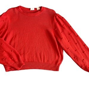 Red crop Levi sweater with flared sleeves